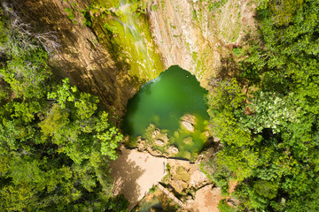 Scenic aerial view of El Limon waterfall in jungles of Samana peninsula in Dominican Republic....