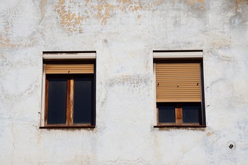 Fototapeta na wymiar window on the white building facade in the city