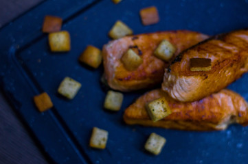 Grilled salmon with croutons.