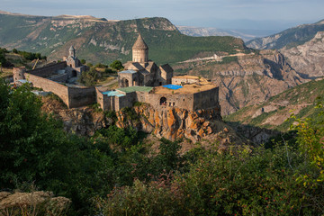 Obraz premium Tatev Monastery. 8th century, Ancient monastery, located in Armenia, Syunik Province , Tatev village. Tatev monastery almost at sunset. beautiful landscape