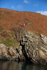 People walking a coastal path on an Autumn day, Laxey, Isle of Man, British Isles