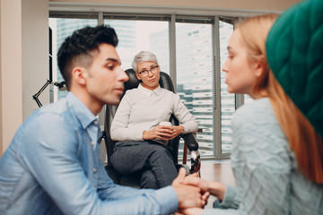 Consultation of couple young man and woman patient on reception for psychologist. Family problems