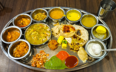 Gujarati Thali a vegetarian food dish in steel plate