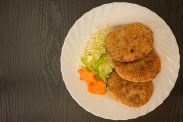 Overlooked homemade croquettes and salad.