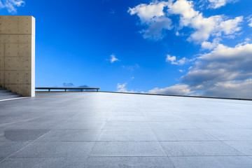 Wide square floor and blue sky with white clouds