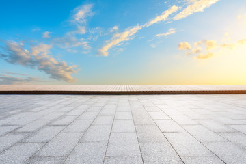 Wide square floor and beautiful sky clouds at sunset