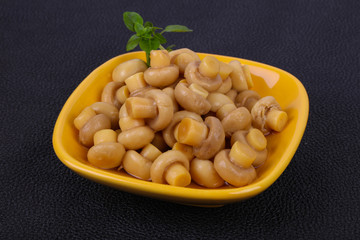 Pickled champignon heap in the bowl