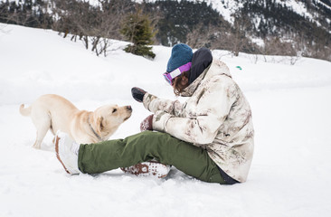 Young adult playing with his dog