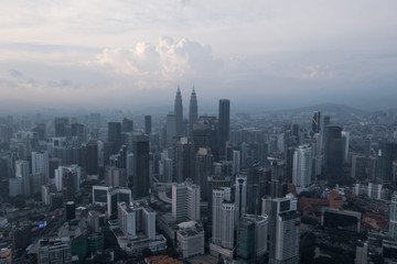 Fototapeta na wymiar Aerial drone view of Kuala Lumpur city skyline during cloudy day