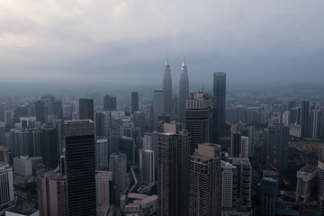 Obraz premium Aerial drone view of Kuala Lumpur city skyline during cloudy day