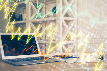 Financial market graph hologram and personal computer on background. Double exposure. Concept of forex.