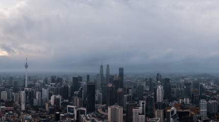 Fototapeta na wymiar Aerial panorama of Kuala Lumpur city skyline during cloudy day