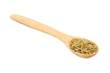 Dry rosemary in a spoon