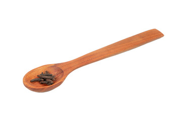 Dry cloves in spoon