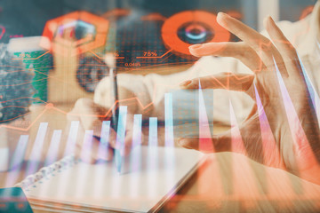 Forex chart displayed on woman's hand taking notes background. Concept of research. Multi exposure