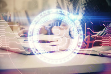 Blockchain theme hologram with man working on computer on background. Concept of crypto chain. Double exposure.