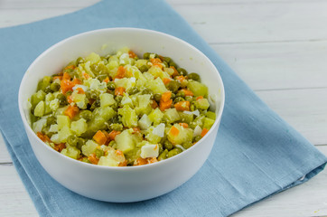 Russian salad Olivier with potato carrot green peas