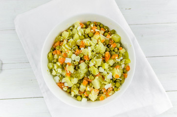 Russian salad Olivier with potato carrot green peas