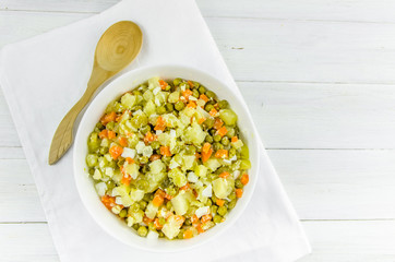 Russian salad Olivier with potato carrot green peas