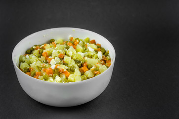 Russian salad Olivier with potato carrot green peas