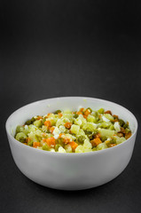 Russian salad Olivier with potato carrot green peas