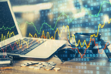 Multi exposure of graph and financial info and work space with computer background. Concept of international online trading.