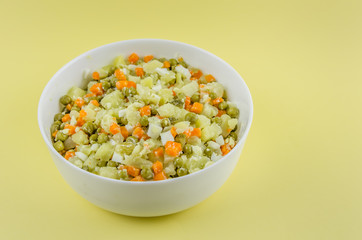 Russian salad Olivier with potato carrot green peas