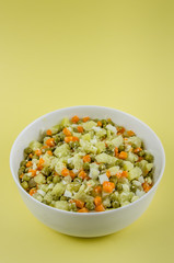 Russian salad Olivier with potato carrot green peas