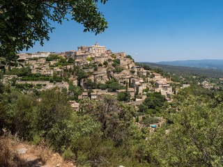 Fototapeta na wymiar France, july 2019: View of Gordes, a small medieval town in Provence. A view of the ledges of the roof of this beautiful village and landscape.