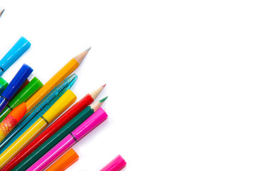 Felt-tip pens and pencils on a white background. Stationery layout. School theme. Preparing for school .Color school supplies isolated on white background. Study