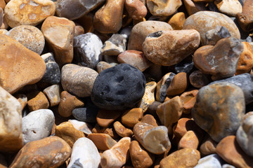 meteorite looking rock on beach