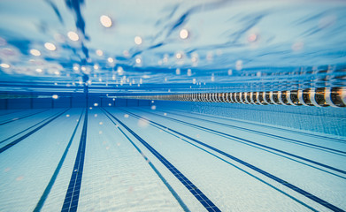 Olympic Swimming pool under water background.