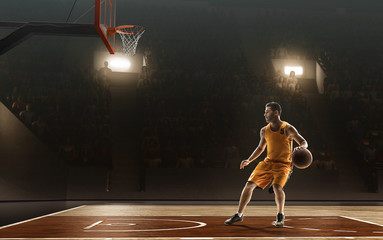 Basketball player in action on a professional basketball arena