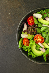 salad healthy, vegetables (avocado, tomato, mix leaves, arugula, lettuce, onions and more) top menu concept. food background. copy space