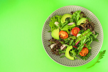 salad healthy, vegetables (avocado, tomato, mix leaves, arugula, lettuce, onions and more) top menu concept. food background. copy space
