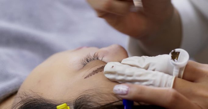Permanent makeup for eyebrows on woman eye