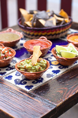 Mexican dip dishes in Mexican clay bowls, for nachos and tortillas
