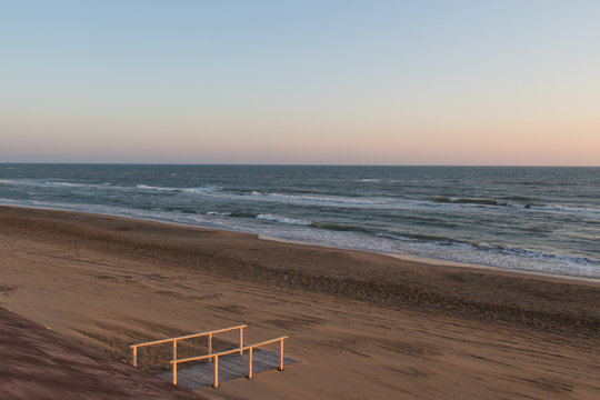 Beautiful sunset on a beach. Twilight on Tyrrhenian sea.