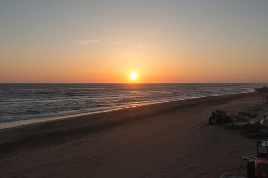 Beautiful sunset on a beach. The sun sets over Tyrrhenian sea.
