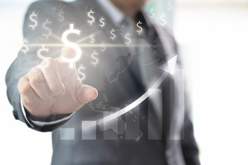 Businessman finger point to US dollar sign for investment and financial analys with inforgraphic chart .US dollar  is main and popular currency of exchange in the world.Investment and saving concept.