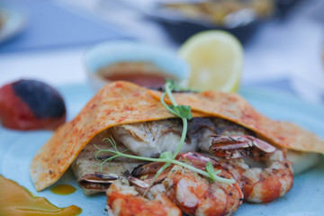 Fish and Shellfish Mixed Grill. Nicely served Mediterranean seafood dish on the restaurant table.