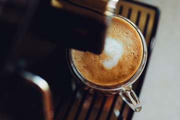 Espresso machine pouring fresh coffee in glass cup. Home professional automatic coffee machine with cappuccino cup. coffee machine espresso kitchen cup hot italian morning concept