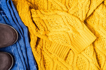 Set of women's autumn, winter clothes - jeans, yellow pullover oversize, suede brown boots. Fashionable clothes for walks, flat lay