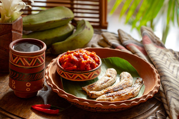 african food. African cuisine called Boli and sauce. fried bananas plantains. Grilled Bananas....