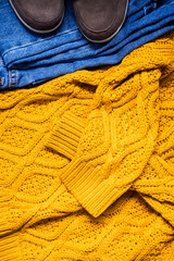 Set of women's autumn, winter clothes - jeans, yellow pullover oversize, suede brown boots. Fashionable clothes for walks, flat lay