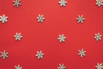 Wooden Snowflakes On Red Background