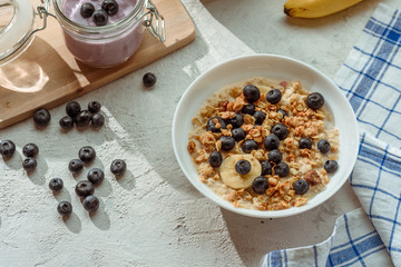 bowl of cereal with blueberries and milk