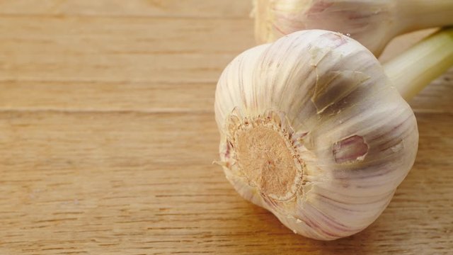 Garlic bulb on wooden rustic board. Healthy food. Place for text, copy space