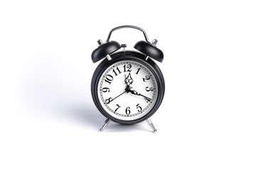 Old alarm clock isolated on white background