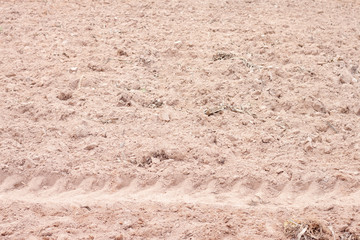 Background and texture of prepare the area for agriculture and tire print tractor on the ground.